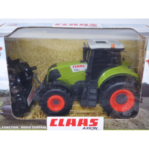 196 - A boxed Zap Toys radio control Claas Axion 850 and a boxed SQS radio control Pershing M26 U.S. Mediu... 