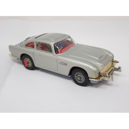 225 - A boxed Corgi Toys No.270 James Bond Aston Martin DB5 with red interior and both figures, lacking in... 