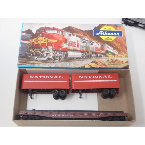 610 - Five boxed IHC HO scale Coaches and seven boxed Athearn Wagons