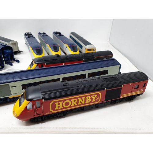 614 - A Hornby 00 gauge Eurostar Set with spare dummy trailer, a Triang BR Pullman Set and a Hornby Virgin... 