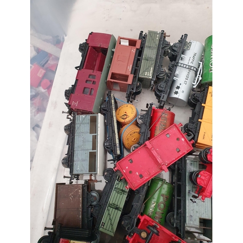 689 - Box containing seven unboxed Hornby Dublo Coaches, Breakdown Crane and approximately 32 Wagons