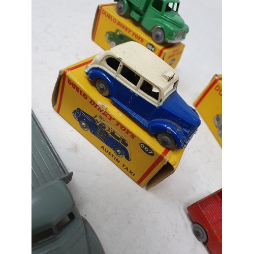 738 - A boxed Dublo Dinky Toys 066 Bedford Flat Truck, boxed 064 Austin Lorry, boxed 067 Austin Taxi, unbo... 