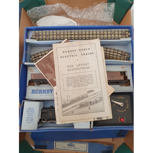 749 - Four Hornby Dublo 3-rail Goods Sets, boxes damaged and contents incomplete