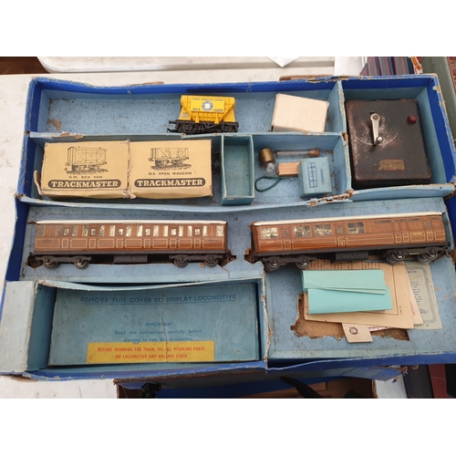 749 - Four Hornby Dublo 3-rail Goods Sets, boxes damaged and contents incomplete