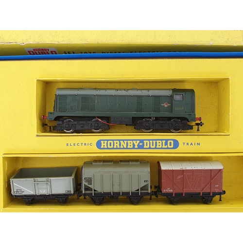 750 - Three Hornby Dublo 2-rail Sets, boxes damaged and contents incomplete