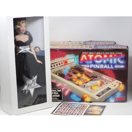 91 - A boxed Franklin Mint Marilyn Monroe Doll, Stars of Hollywood Stamps and two boxed Atomic Flipper Pi... 
