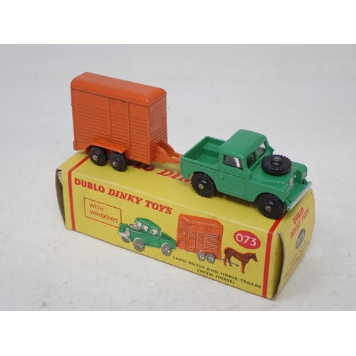 19 - Dublo Dinky Toys 073 Land Rover and Trailer, boxed with horse and black wheels. Mint condition, box ... 