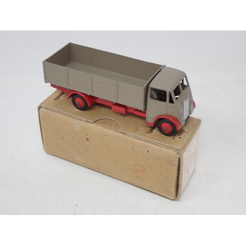 216 - Dinky Toys 511 Guy 4-ton Lorry with fawn body and red chassis, boxed