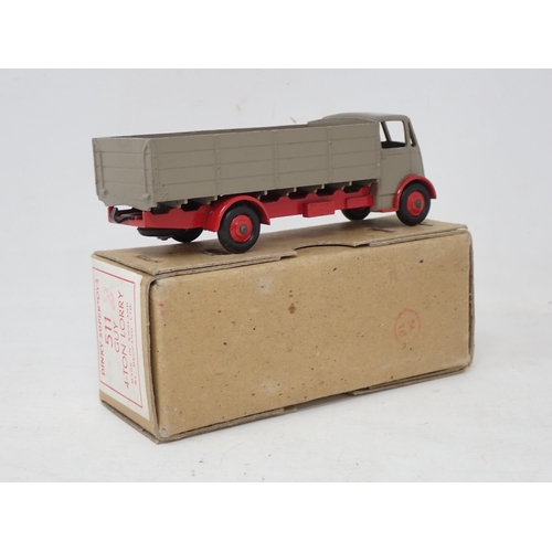 216 - Dinky Toys 511 Guy 4-ton Lorry with fawn body and red chassis, boxed