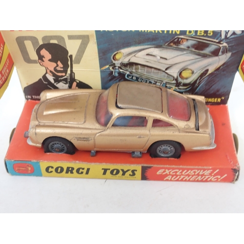 296 - Corgi Toys 261 James Bond 007 Aston Martin DB5 with figures and instructions, boxed with display