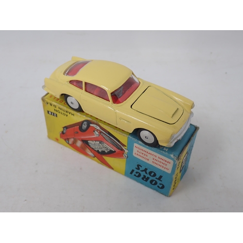 300 - Corgi Toys 218 yellow Aston Martin DB4, boxed