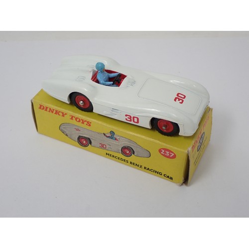 352 - Dinky Toys 237 Mercedes Benz Racing Car with red plastic hubs and blue driver, boxed