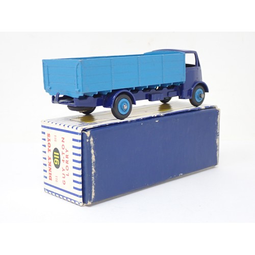 356 - Dinky Toys 911 Guy 4-ton Lorry with dark blue cab and pale blue back, boxed