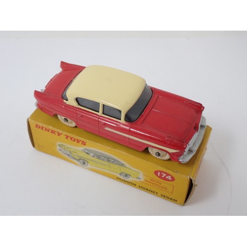 392 - Dinky Toys 174 red and yellow Hudson Hornet Sedan, boxed