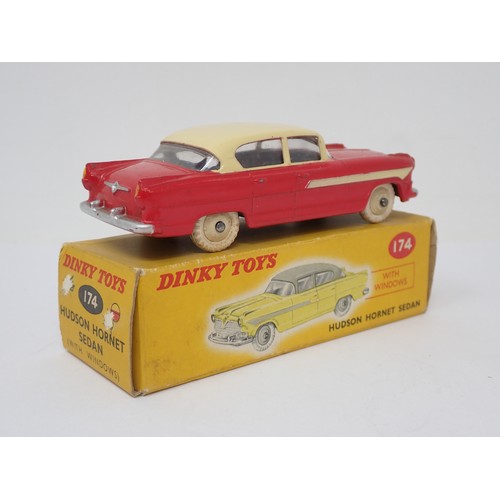 392 - Dinky Toys 174 red and yellow Hudson Hornet Sedan, boxed