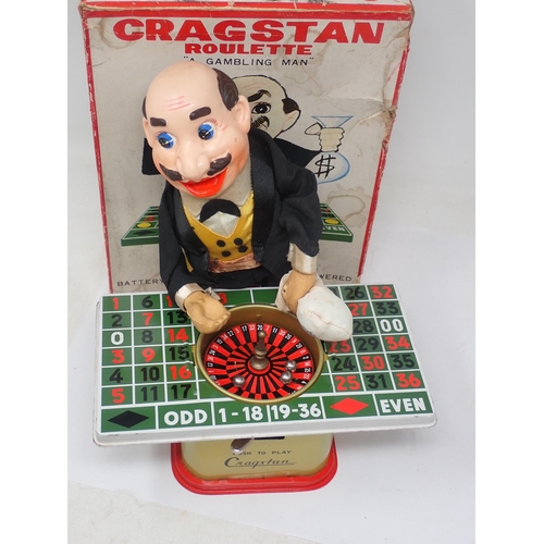 434 - A boxed Cragstan Toy battery powered Cragstan Roulette Gambling Man