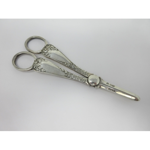 106 - A pair of Edward VII silver Grape Scissors with leafage decoration, London 1901