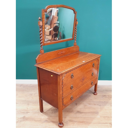 43 - An oak Mirror Back Dressing Chest fitted three long Drawers on square cut supports and bun feet, 5ft... 