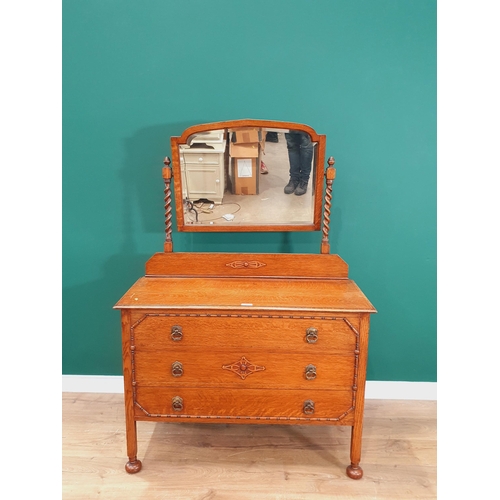 43 - An oak Mirror Back Dressing Chest fitted three long Drawers on square cut supports and bun feet, 5ft... 