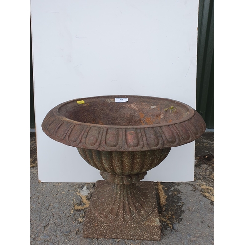 623 - A cast iron garden Urn with egg and dart border, pedestal base, 14in H