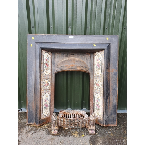 624 - A cast iron Fireplace inset with floral tiles, (A/F) including grate, 3ft 4in H x 3ft 2in W