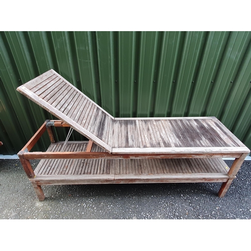 628 - A pair of slatted wooden adjustable Sun Loungers, labelled 'Scancom', 6ft 5in L