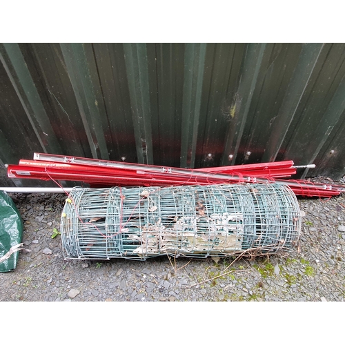 631 - A roll of sheet fencing and a quantity of red blinds