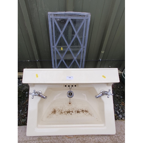 636 - A ceramic bathroom sink and a leaded glass panel