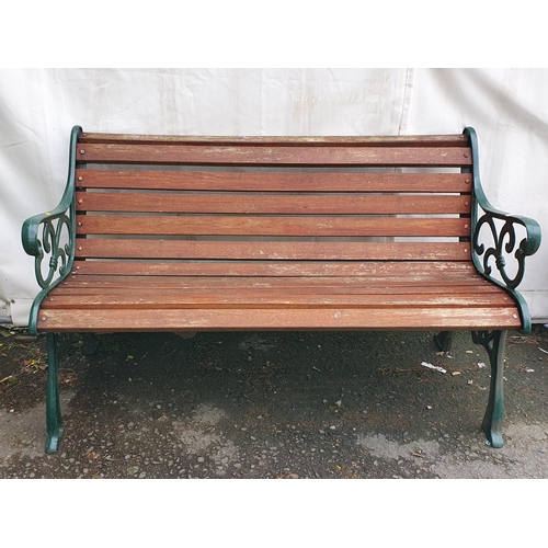 639 - A cast-iron green painted slatted Garden Bench