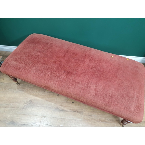 645 - A large modern re upholstered Footstool on turned supports and castors, 4ft 10