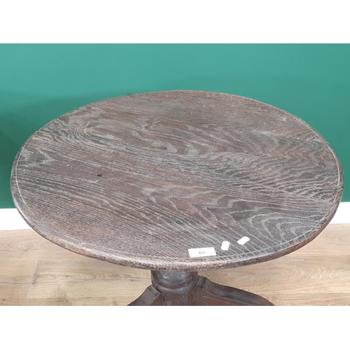 65 - A mixed wood Circular Tripod Table 2ft 6