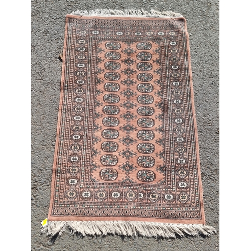 80 - A small Persian Rug with multiple borders and rows of medallions, 5ft 5in x 3ft