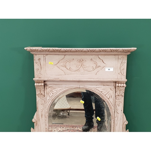 88 - A grey painted wooden framed Over Mantle Mirror with arched bevelled plate, 3ft 6