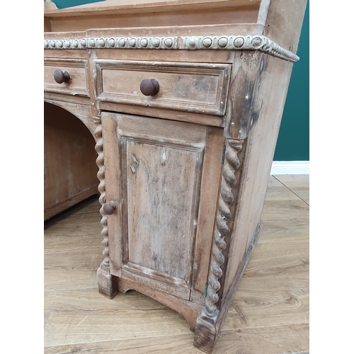 98 - A Victorian pine Kneehole Desk with raised and shaped gallery, above three fitted drawers above pair... 