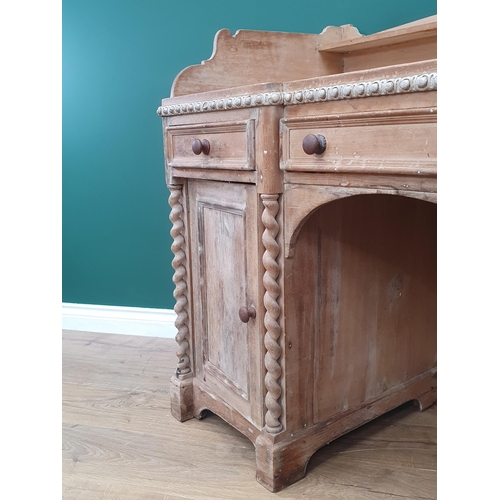 98 - A Victorian pine Kneehole Desk with raised and shaped gallery, above three fitted drawers above pair... 