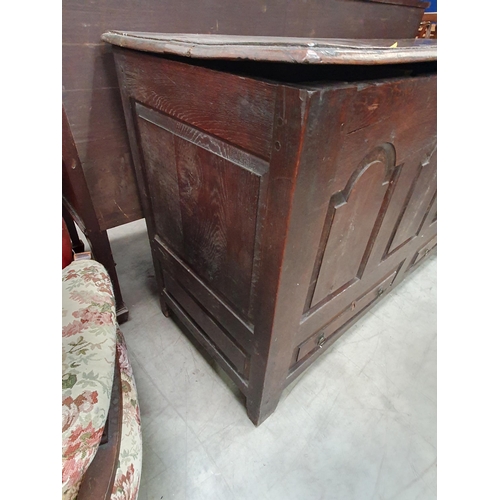 36 - An antique oak Mule Chest, the two plank lid above arched panel front, above pair of fitted drawers,... 