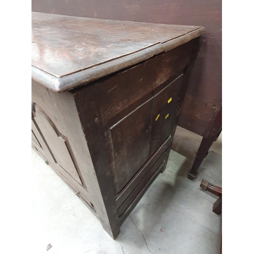 36 - An antique oak Mule Chest, the two plank lid above arched panel front, above pair of fitted drawers,... 