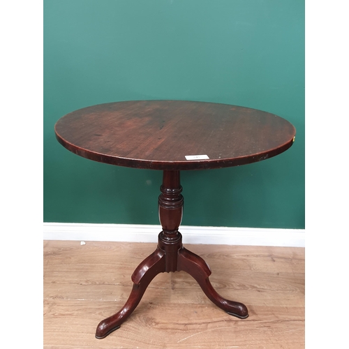 545 - A Georgian mahogany Tripod Table with circular top on baluster column, 2ft 4in diam