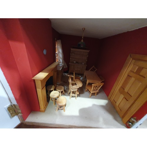 649 - An Anglesey Dolls house  1999 with lights complete with furniture