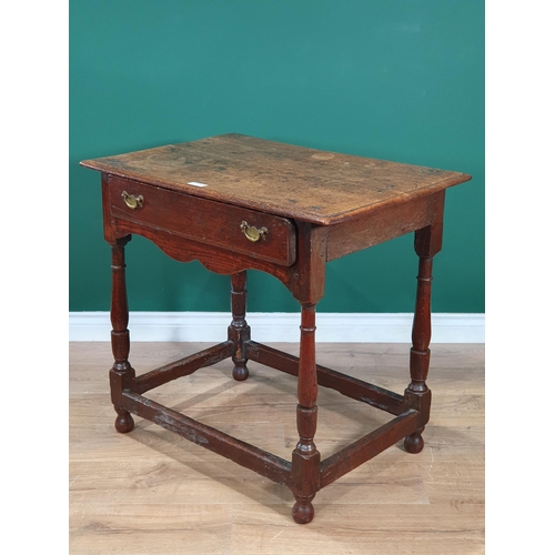 1 - An 18th Century oak Side Table, with single fitted drawer, above shaped frieze on turned supports wi... 