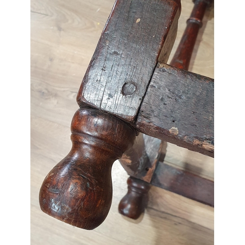 1 - An 18th Century oak Side Table, with single fitted drawer, above shaped frieze on turned supports wi... 