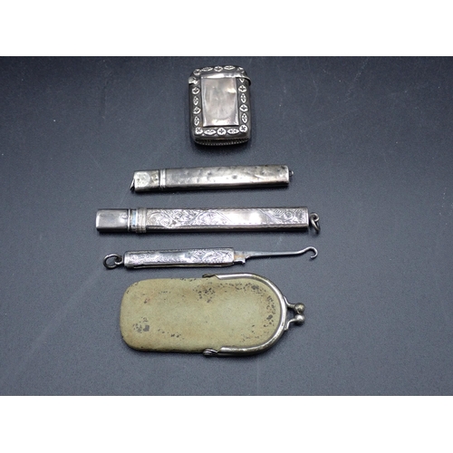 148 - A Victorian silver Vesta Case, Birmingham 1895, two silver Pencil Holders and a folding Button Hook,... 