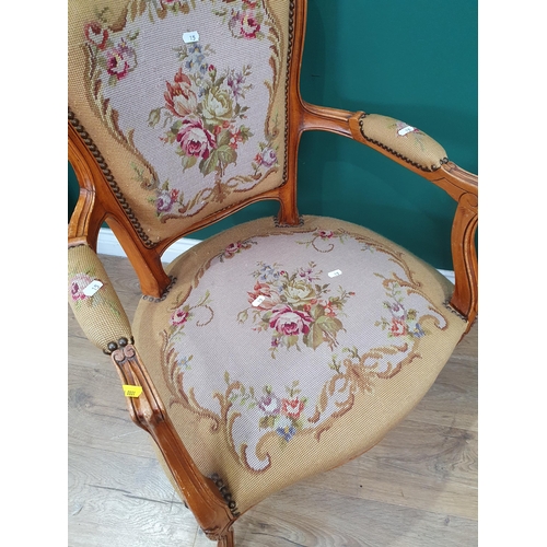 15 - Two French Elbow Chairs with floral upholstered backrests, seats and armrests with carved scroll and... 