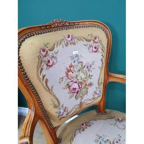 15 - Two French Elbow Chairs with floral upholstered backrests, seats and armrests with carved scroll and... 