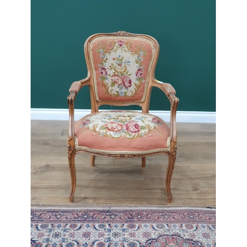 15 - Two French Elbow Chairs with floral upholstered backrests, seats and armrests with carved scroll and... 