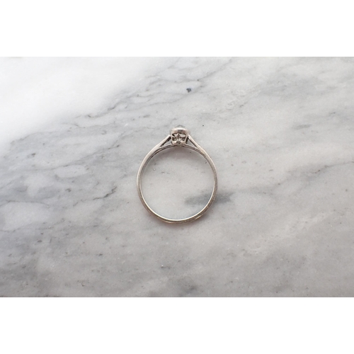 155 - An early 20th Century Diamond Ring rubover-set old-cut stone between smaller stones pavé-set to shou... 