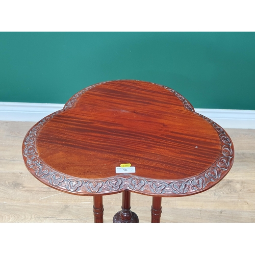 16 - A reproduction mahogany Occasional Table with clover shaped top, above shaped supports on tripod bas... 