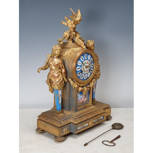 18 - A 19th Century French ormolu Mantel Clock with blue porcelain dial and panels, with figure and bird ... 