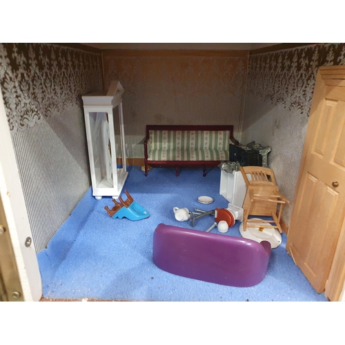 215 - A white painted Dolls House with assorted Furniture and accessories, 2ft 8