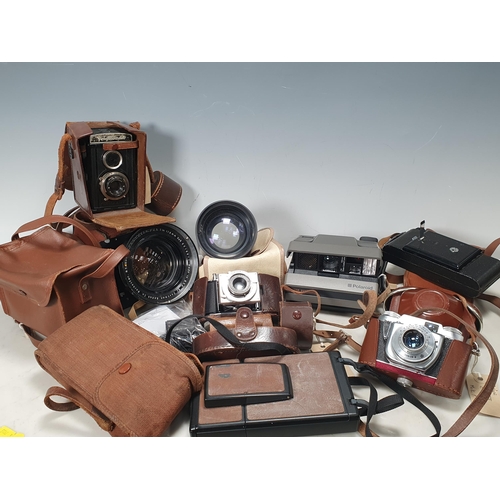 217 - A Beirette Junior II Camera in case, a Polaroid Image System, an Agfa Karat Camera in case, a Voigtl... 